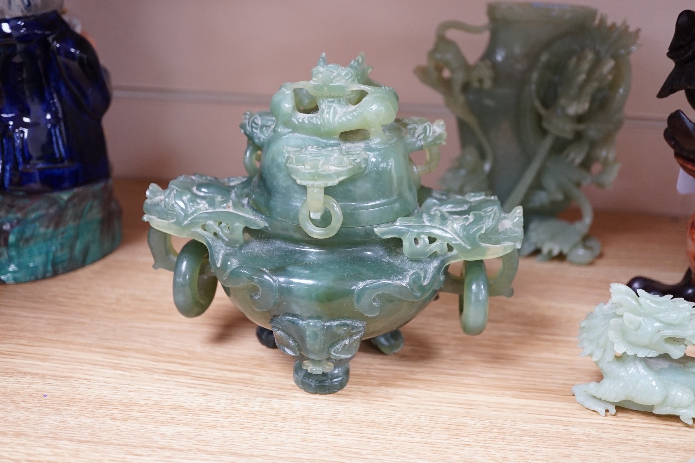 Four Chinese bowenite jade carvings - two mythical beasts, a censer and cover and a ‘dragon’ vase and cover, largest 28cm long